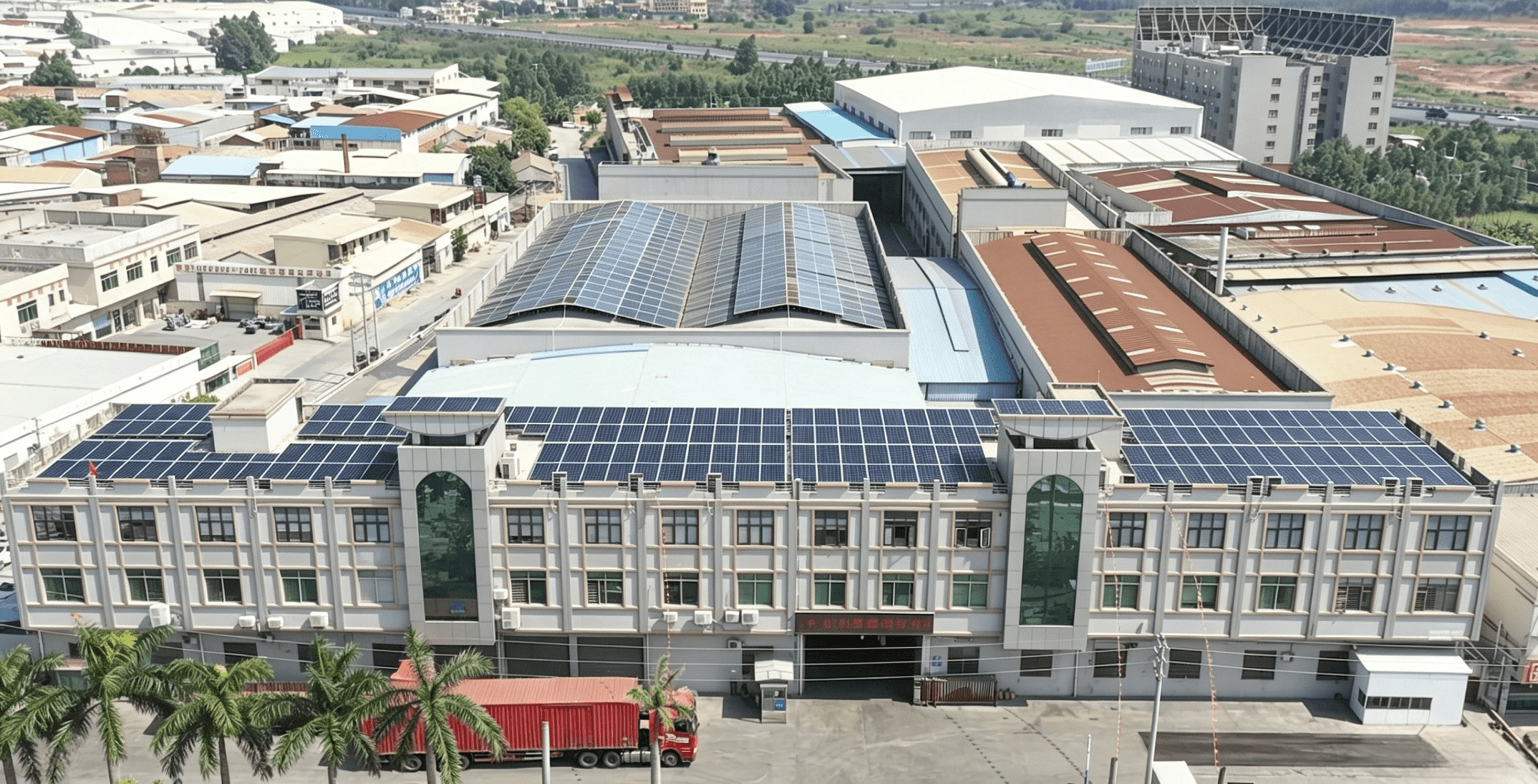 Aerial view of a production base covered with solar panels